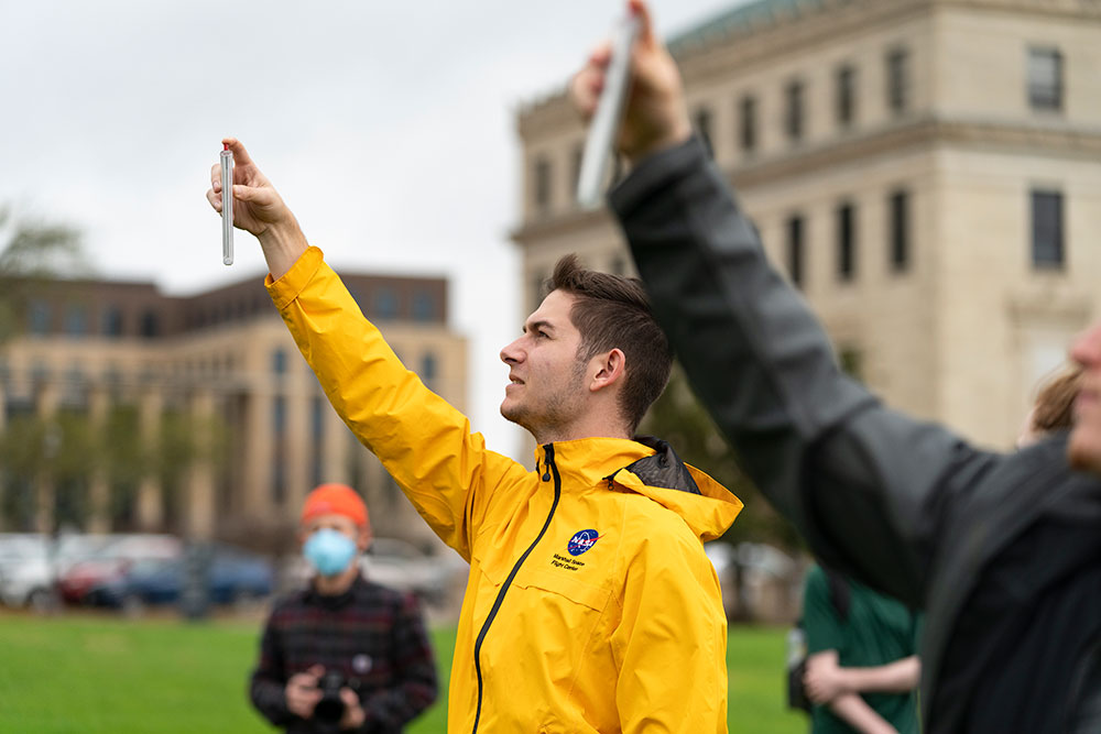 Atmospheric Sciences student conducts an outdoor lab on Texas A&M Campus