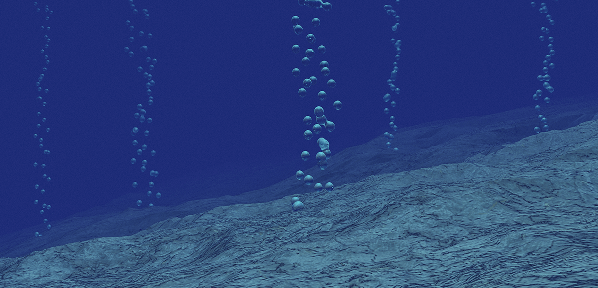 Methane gas bubbles rising from the ocean floor. 
