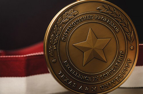 Close up of the gold University Distinguished Professor medal