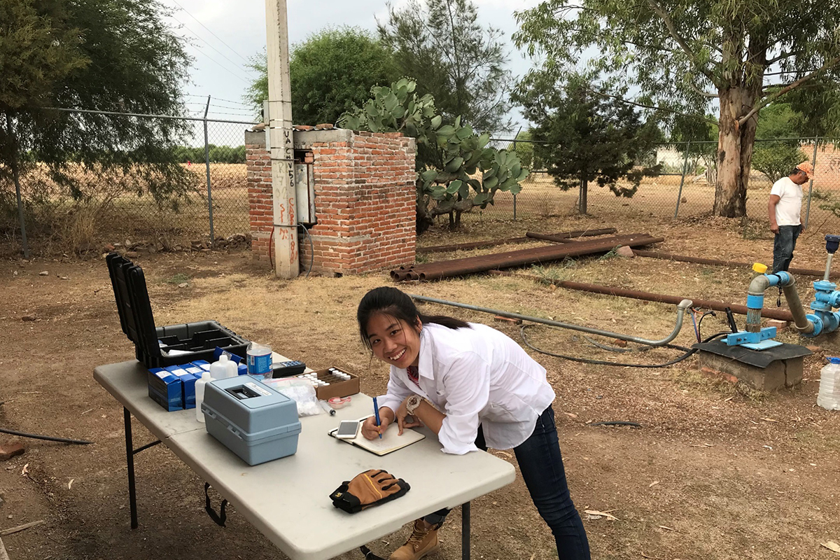 Texas A&amp;M geology and geophysics Ph.D. student Yibin Huang, analyzing water chemistry and collecting water samples from a drinking water production well in Guanajuato, Mexico, in 2018. 