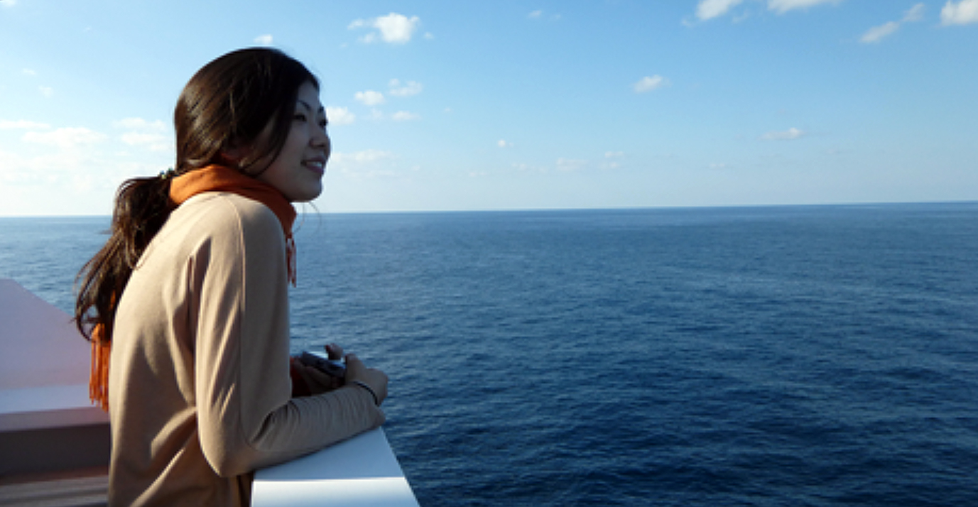 Texas A&M geologist Hiroko Kitajima on deck, looking out at the open sea