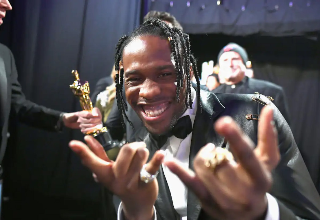 Actor Shameik Moore, who voiced Miles Morales in "Spider-Man: Into the Spider-Verse," celebrates with a web-shooting pose after the film won best animated feature at the Academy Awards in 2019