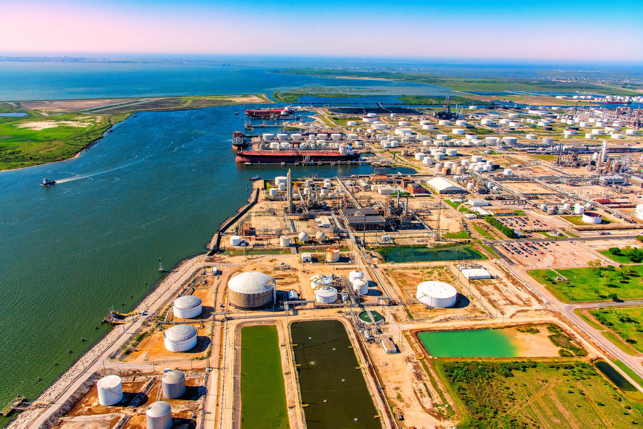 Aerial view of international oil tankers docked at a U.S. oil refinery off the Gulf of Mexico in Texas City, Texas located just south of Houston