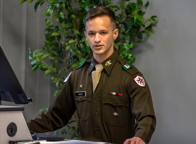 Texas A&M University junior history major Jackson Baker presents his research at the Never Forgotten: Conflict Archaeology and Military History at Texas A&M Symposium on Nov. 9, 2023