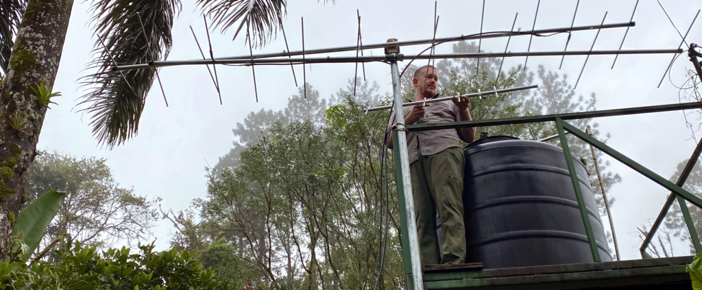 Ernesto Carman from Proyecto Cerulea works to install a Motus receiver to detect and track wildlife on behalf of Finca Cántaros Environmental Association in Costa Rica