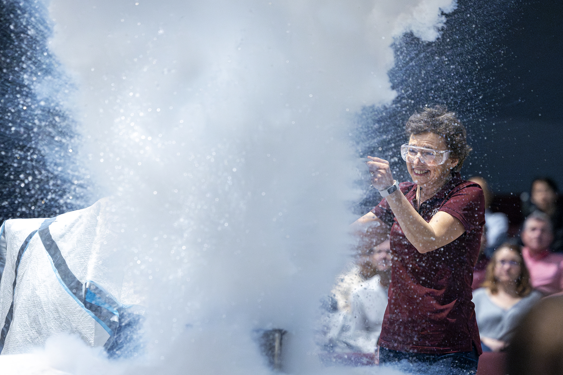 Texas A&M physicist Tatiana Erukhimova is engulfed by a massive cloud of liquid nitrogen at Aggieland Saturday, held February 10, 2024, on the Texas A&M campus