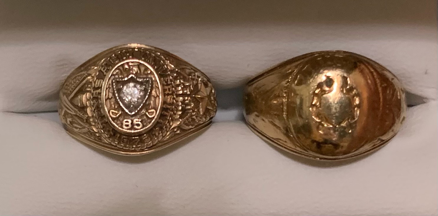 Shari Boothe's new and old Aggie Rings, displayed side by side in a ring box