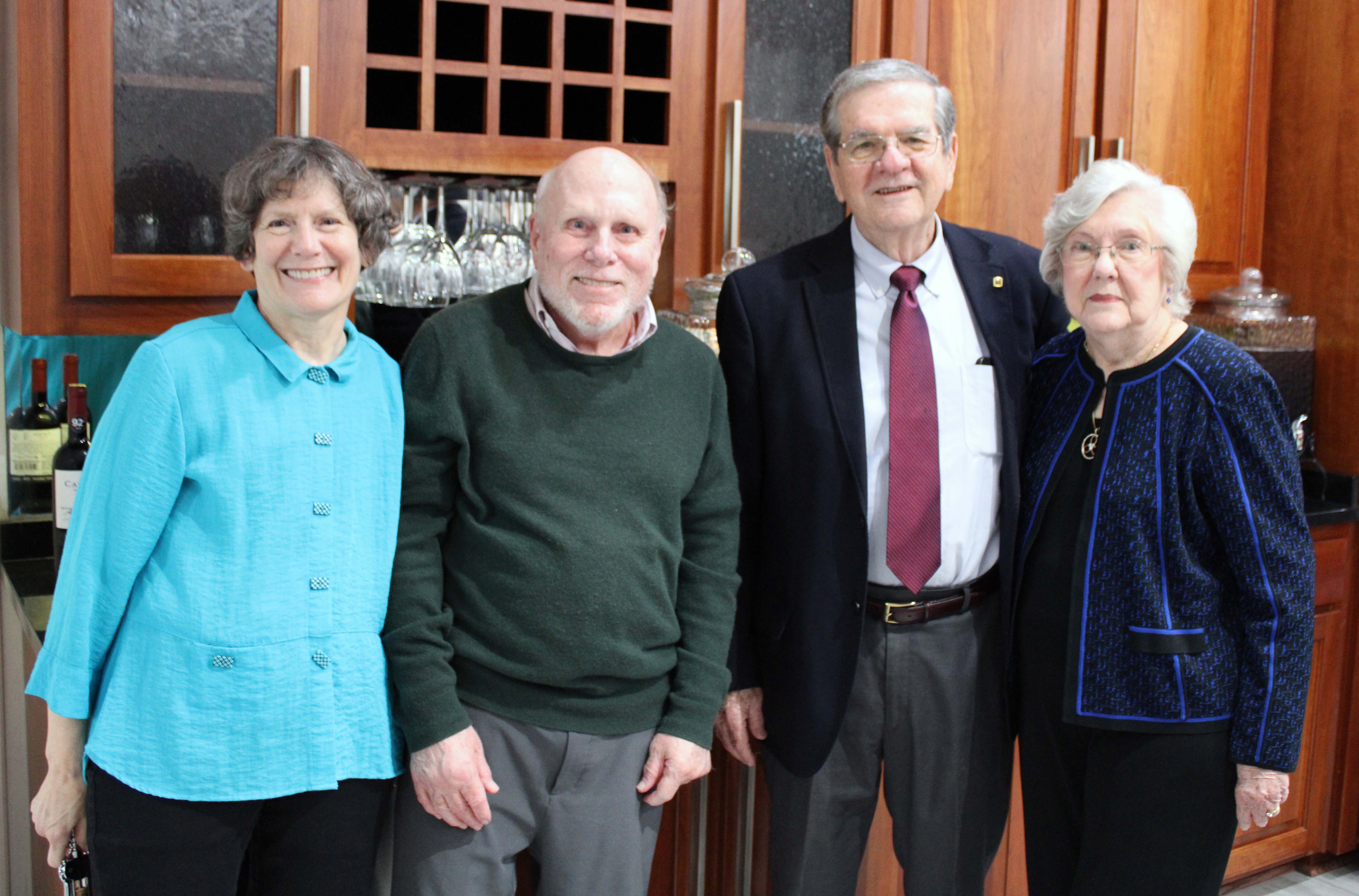 Texas A&amp;M University statisticians Dr. William B. Smith and Dr. Raymond J. Carroll pose together with their wives, Patricia R. Smith and Dr. Marcia Ory, at the Texas A&amp;M Department of Statistics' 60th anniversary celebration in fall 2022