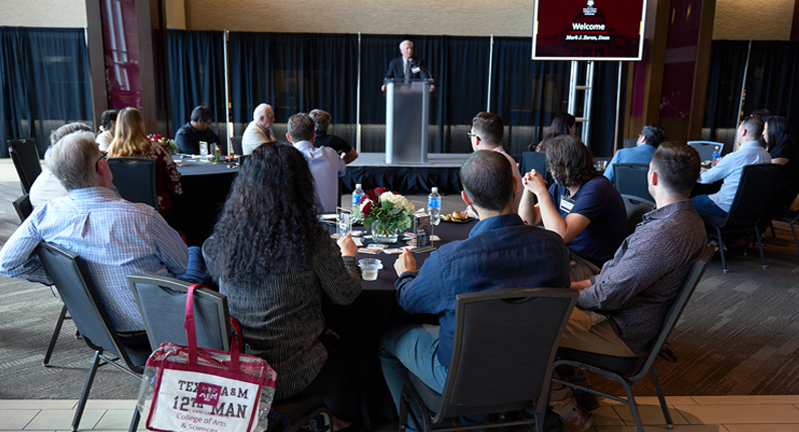 Texas A&M University College of Arts and Sciences Dean Mark Zoran addresses the crowd from behind the podium in the All-American Club at Kyle Field during the 2024 College of Arts and Sciences New Faculty Welcome Reception on September 12, 2024