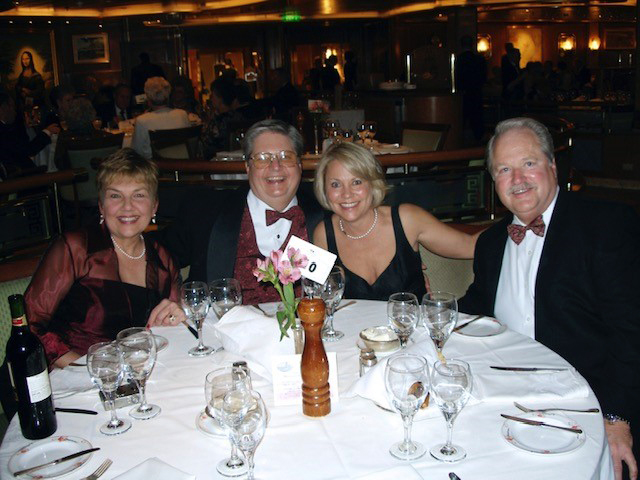 Patricia and James W. Chancellor '68 and Dana and Jon Chancellor '71, dining during a cruise in the early 2000s